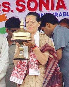 Congress President Sonia Gandhi with a traditional Assamese sorai at an election rally in Mangaldoi on �Assamese Bihu Day�