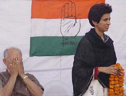 Mr Phool Chand Mullana, who was a contender for the Congress ticket in Ambala, wipes his face even as actual Congress candidate Kumari Selja looks on