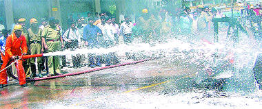 Delhi Fire Service personnel giving a demonstration in firefighting techniques during the �Fire Service Week� at Barakhamba Road in the Capital on Wednesday.