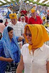 Devotees from the UK come out of Gurdwara Rakab Ganj Sahib after the Baisakhi  prayers