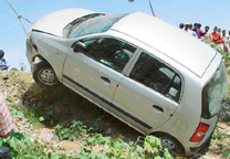 The car that fell into the Patiala ki Rao choe near the furniture market, Chandigarh, being lifted by a crane on Thursday.