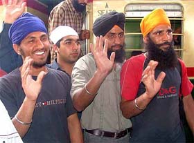 From left: Avtar Singh, Jagminder Singh and Balbir Chand after their arrival at the Attari railway station