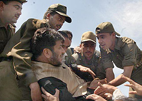 Shabir Ahmad Shah, Chairman of the Democratic Freedom Party, being taken away by the police in Srinagar on Thursday.