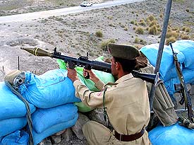 A Pakistani paramilitary trooper stands guard at a check post at Wana in southern Pakistan's Waziristan tribal area