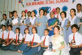 Prize winners of BCM Arya Model Senior Secondary School, Shastri Nagar, Ludhiana, pose for a group photograph after the annual function