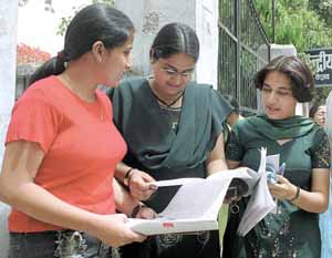 Students of the CBSE pre-medical examination cross-checking before entering the examination hall in the Capital on Saturday. The examination was rescheduled after the question papers leaked last week.