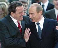German Chancellor Gerhard Schroeder welcomes Russian President Vladimir Putin prior to his birthday party at Hanover on Friday.
