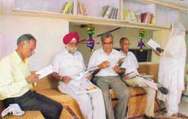 Senior citizens at a newly opened library at the Manav Nishkam Seva Kendra in Ludhiana