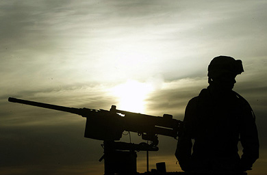 A US soldier sits atop a Humwee at a military base near the Iraqi holy city of Najaf 