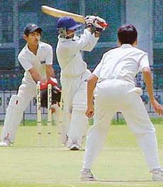 Hemant of Mohali XI being bowled out by Aman of Minor District-A XI is the Inter-District Cricket Meet in Mohali