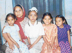 Eleven-year-old Jaswinder Singh with his mother and three sisters