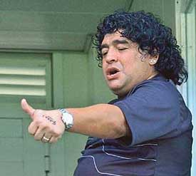 Argentine former football star Diego Maradona gestures during the match between Boca Juniors and Nueva Chicago in Buenos Aires