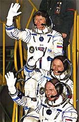 The crew of the Russian Soyuz TMA-4 spacecraft, American astronaut Michael Fincke, Russian cosmonaut Gennady Padalka and Dutch astronaut Andre Kuipers before their launch at the Balkonur cosmodrome in Kazakstan 