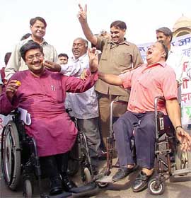 Convener of the Disabled Rights Group Javed Abdul celebrates at India Gate in New Delhi  on Tuesday after the Supreme Court judgement regarding special provisions for the physically challenged at polling stations to enable them to excercise franchise. 