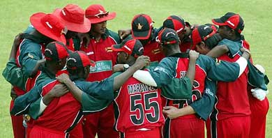 The novice Zimbabwean cricket team huddles before taking the field against Sri Lanka at the Queens Sports Club