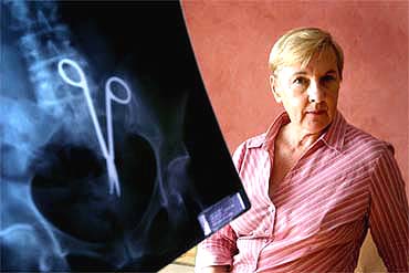Australian Pat Skinner (69) poses with her pelvic X-ray in Sydney on Tuesday