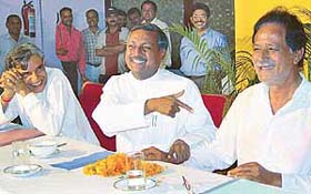 Mr Satya Pal Jain (BJP) shares a joke with Mr Harmohan Dhawan, INLD and Mr Pawan Kumar Bansal (Congress), at a discussion organised by the Chandigarh Beopar Mandal