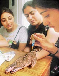 Students of the GNIMT take part in a mehndi competition during a three-day cultural festival in Ludhiana 