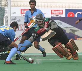 Indian forward Tushar Handker  scores against Sri Lanka during their match at the fifth Junior Asia Cup hockey tournament in Karachi 