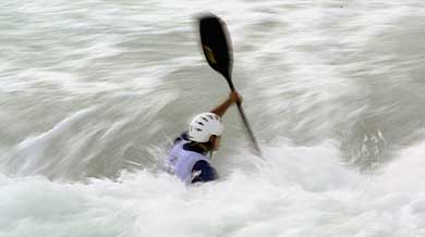 An unidentified athlete races in a slalom Canoe race for the Athens 2004 World Cup at the Olympic Canoe/Cayak Centre