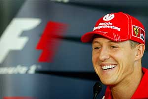 Ferrari Formula One world champion Michael Schumacher of Germany smiles as he addresses a news conference