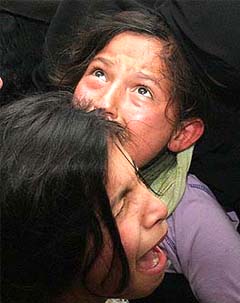 Palestinian relatives of 15-year-old Ayob Karsoh weep during his funeral at Beit Lahiya