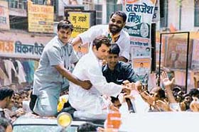 Rahul Gandhi, son of Congress President Sonia Gandhi, surrounded by his party supporters during his election campaign in Varanasi