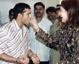 Anjali Tendulkar feeds a cake to her husband, Sachin Tendulkar