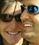 BMW Williams Formula One driver Juan Pablo Montoya of Colombia and his wife Connie smile during the first free practice session