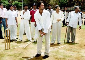 Shoaib Akhtar plays cricket during the inauguration of a cricket tournament for physically challenged boys in Mumbai