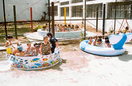 Kids enjoy in a pool at J P Bal Niketan Public School on Saturday.