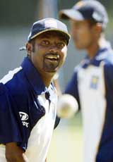 Sri Lankan bowlers Muttiah Muralitharan smiles after bowling a delivery during a practice session at the Harare Sports Club on Saturday in preparation for the third one-day match against Zimbabwe on Sunday. � Reuters