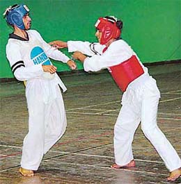Vikram of Himachal Pradesh and Rupinder of Punjab in action during the first North India Taekwondo Championship