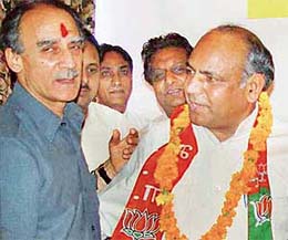 Union Minister for Development, Information Technology and Communications Arun Shourie welcomes former bureaucrat of Haryana M.L. Sarwan to the BJP fold in Panchkula