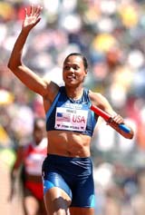 Olympian Maron Jones waves after anchoring the Olympic development 400-meter relay at the Penn Relays in Philadelphia