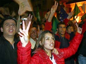 Turkish Cypriot supporters of the UN reunification plan celebrate in the Turkish part of capital Nicosia