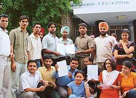 Students of the Department of Mathematics, Panjab University, alleging leak of their paper, sit on a dharna outside the VC�s office