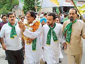 INLD candidate Harmohan Dhawan campaigns at the Sector 27 market in Chandigarh