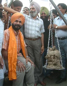 BJP supporters weighing Mr Navjot Singh Sidhu against coins in Amritsar