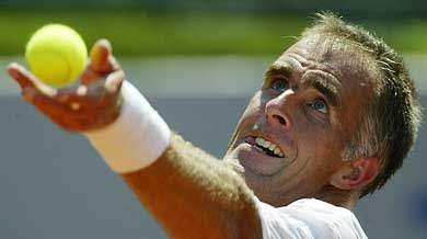 Todd Martin of the US serves against Spanish David Ferrer