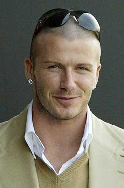 England and Real Madrid midfielder David Beckham arrives at a London sports shop