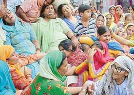 Wailing members of the Chandolia family in Chandigarh
