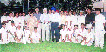 Khalsa College principal Dr Daljit Singh Claire and physical education director Pargat Singh inaugurate the new cricket pitches at the Khalsa College cricket ground.