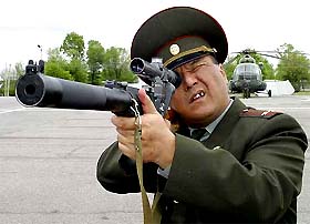 A Kyrgyz Army Lt. Col. tests a Russian VSS Vintorez, a special purpose silenced sniper rifle, delivered to Kyrgyzstan's special forces at the Kant base