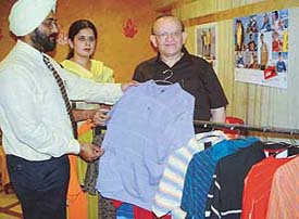 Mr Komal Jain (right), Chairman, Duke group, shows the new range of Duke T-shirts in Chandigarh on Wednesday. 