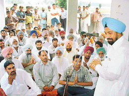 Mr Balwant Singh Ramoowalia addresses villagers of Bagga Kalan on Wednesday. 