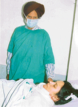 Rajinder Kaur, a dowry victim,  fights for life in DMC Hospital in Ludhiana on Wednesday. 