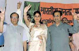 Actress Vijaya Shanti with BJP South Delhi Candidate Vijay Kumar Malhtora and BJP MLA Jagdish Mukhi flashing the victory sign at R.K. Puram in the Capital on Tuesday. 