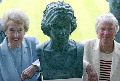Former Wimbledon champions, Angela Mortimer of 1961 and Anne Jones of 1969, flank a bust of fellow champion Virgina Wade at the All England Lawn Tennis Club, at Wimbledon, London, on Tuesday