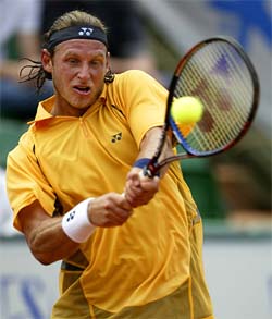 David Nalbandian of Argentina hits a backhand return to Todd Martin of the US 